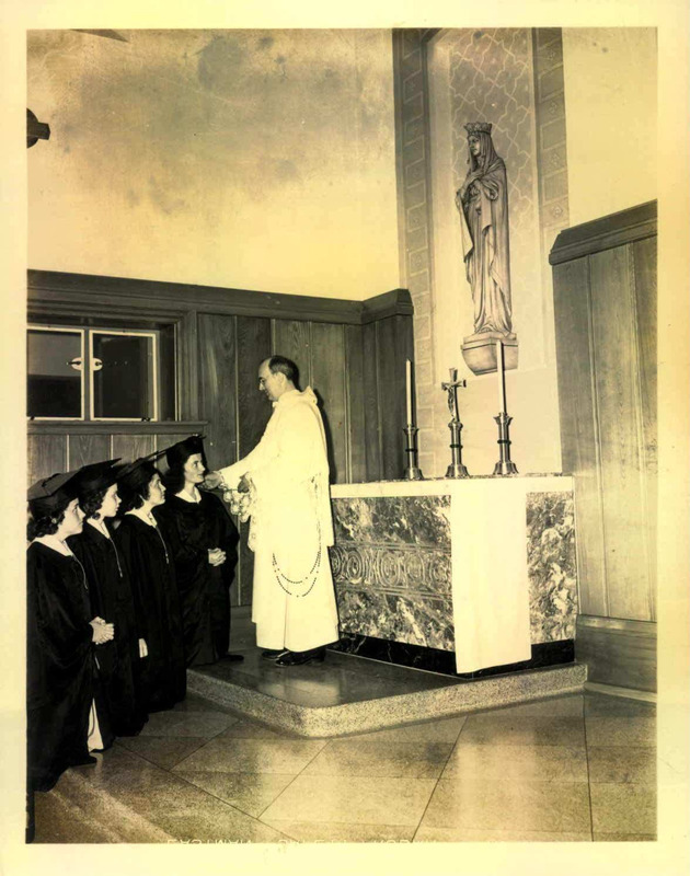 College chaplain, Father James Walker, blessing members of the Sodality group